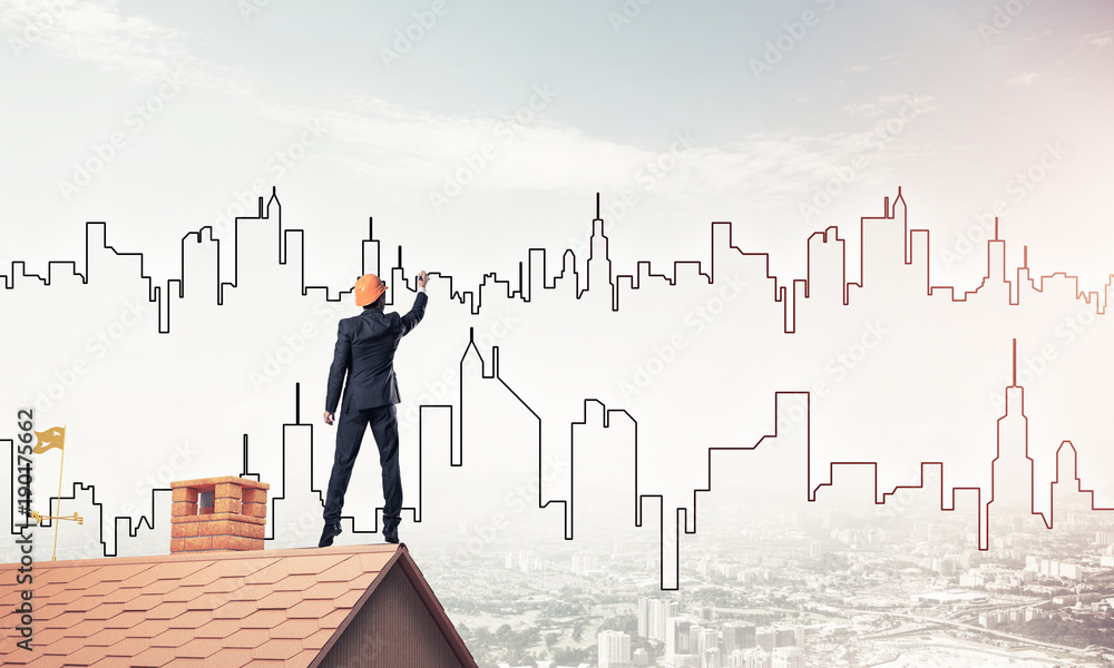 Man architect draw silhouette of modern city on blue sky. Mixed Man architect draw silhouette of modern city on blue sky. Mixed
