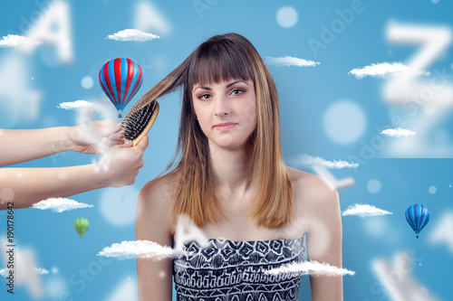 Young woman at hairdresser with air balloon theme © ra2 studio
