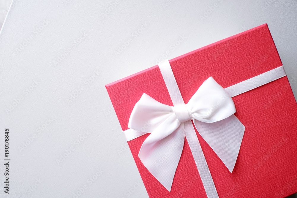 Valentine present. Gift box and red ribbon for romantic couple. Valentine present. Gift box and red ribbon for romantic couple.