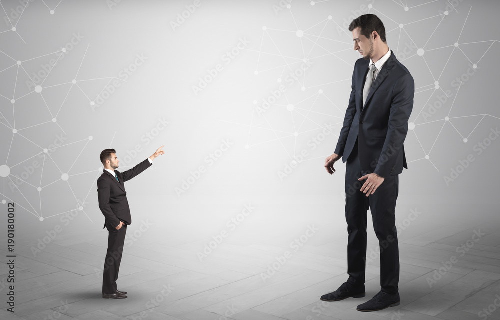 Small man aiming at a big man with network concept Small man aiming at a big man with network concept