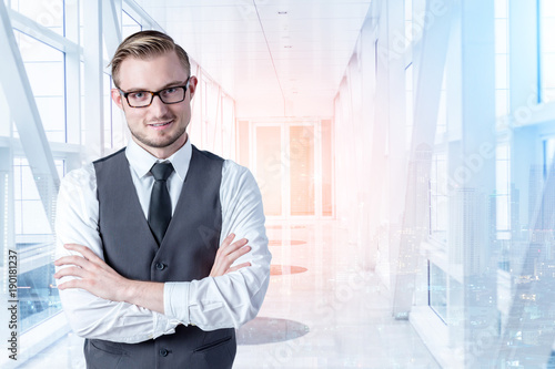 caucasian businessman with nice smile and background of white spce public corridor