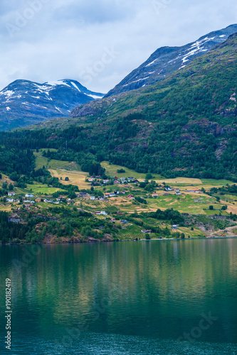 Norwegian country houses in the mountains on lake shore
