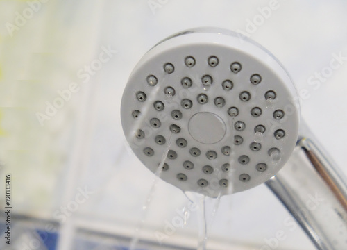 clogged showerhead with weak streams of water