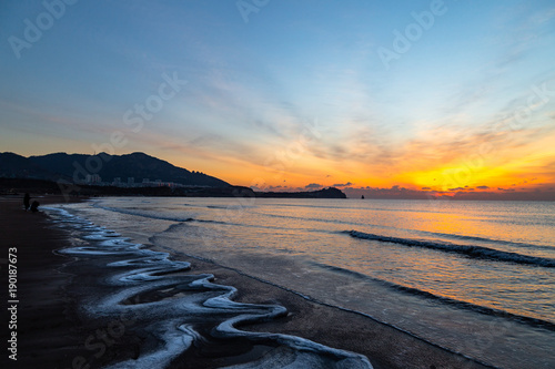 24th Jan 2018, Qingdao, Shandong. Sunrise on Shilaoren Beach, in a morning so cold that the water from the sea is turned into ice photo