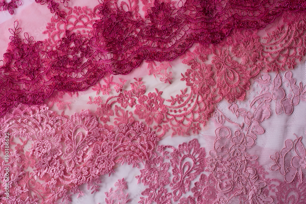 Assortment of pink lace on white background. can be use as a background and wallpaper