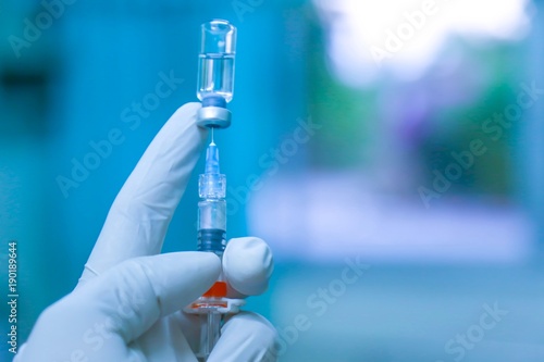 Medication drug needle syringe drug,medical concept flu shot vaccine vial dose hypodermic injection treatment disease care in hospital,prevention immunization illness in children.selective focus.