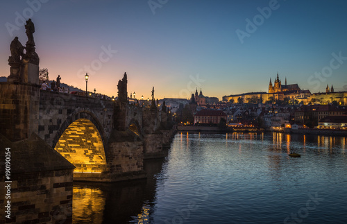 It's evening in the city of Prague. View of the castle and the Charles bridge. Czech Republic.