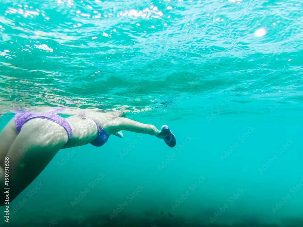 Swimmer under water while snorkeling