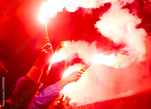 football fans lit up the lights and smoke bombs. revolution. protest