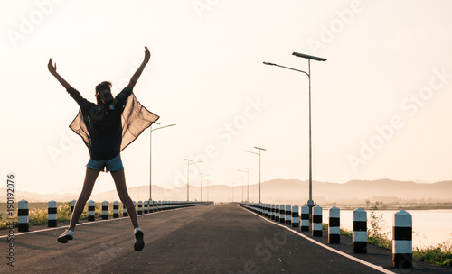 Woman jumping on the road