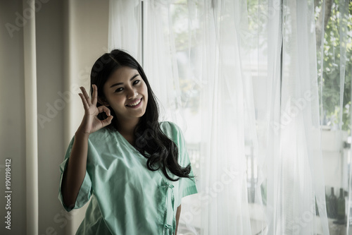 Female patient standing in the room in hospital. Hope concept.