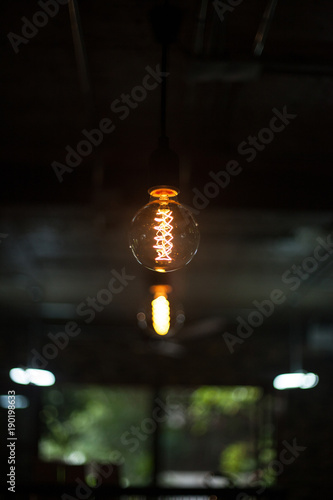 light bulb on ceiling © Theerapong