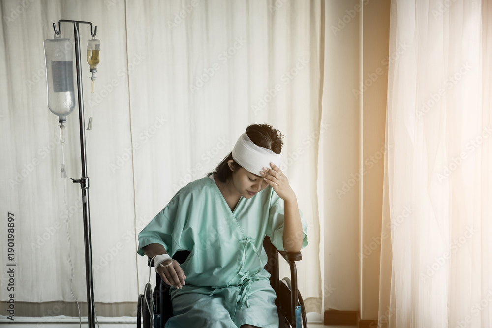 Female patients sitting on wheelchairs have pain after hospitalization.