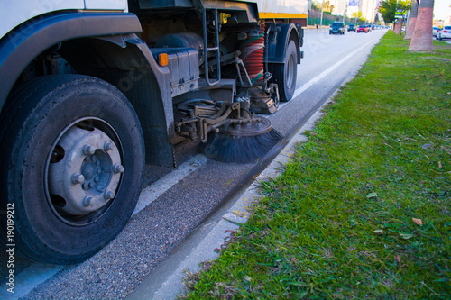 detail of a street sweeper machine car cleaning the road