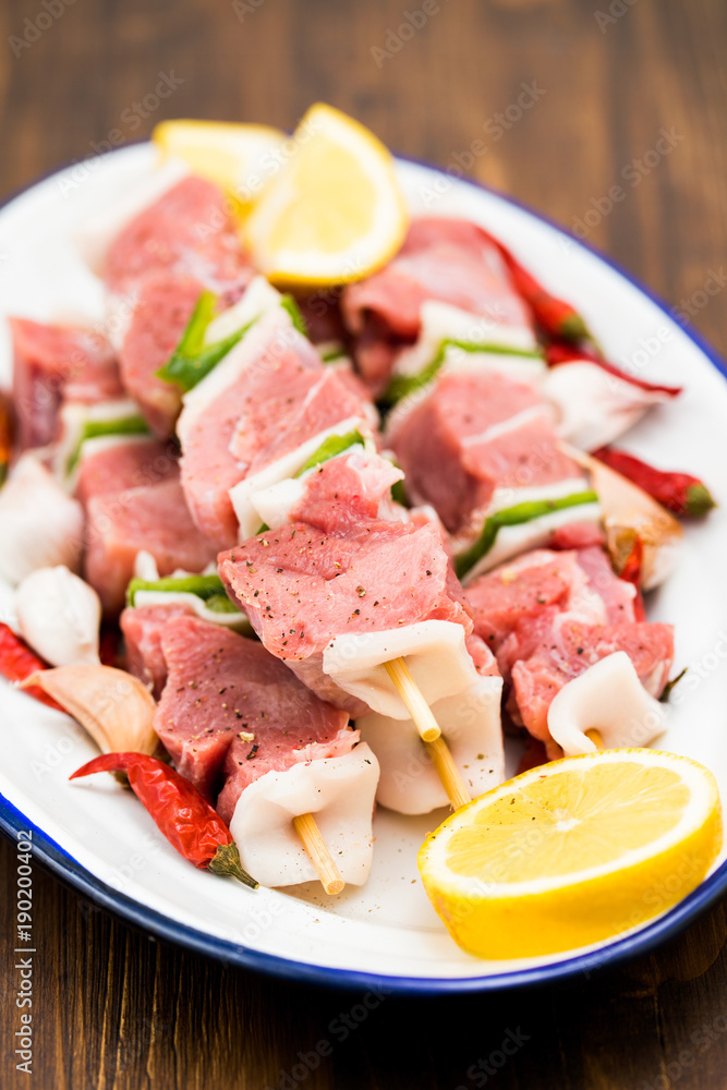 raw turkey fillet with pepper and lemon