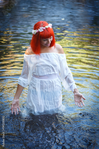 Fototapeta Naklejka Na Ścianę i Meble -  Beautiful woman bathing in a beautiful river