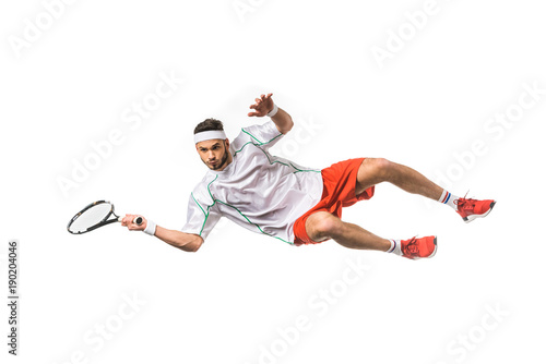 handsome young sportsman playing tennis in jump isolated on white