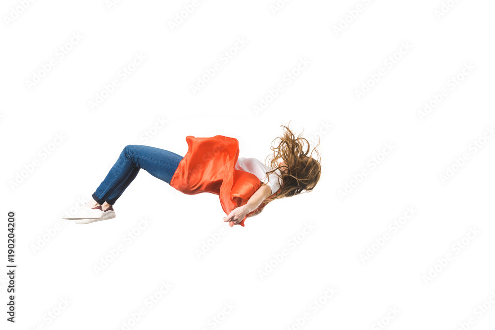 side view of girl in red mantle falling isolated on white - obrazy, fototapety, plakaty 