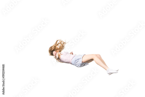 full length view of young woman falling isolated on white photo