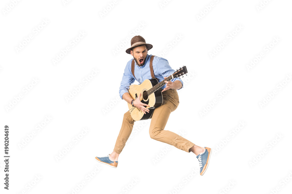 young man with open mouth playing guitar and jumping isolated on white young man with open mouth playing guitar and jumping isolated on white