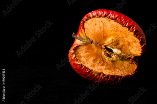 Shrivel red apple photo