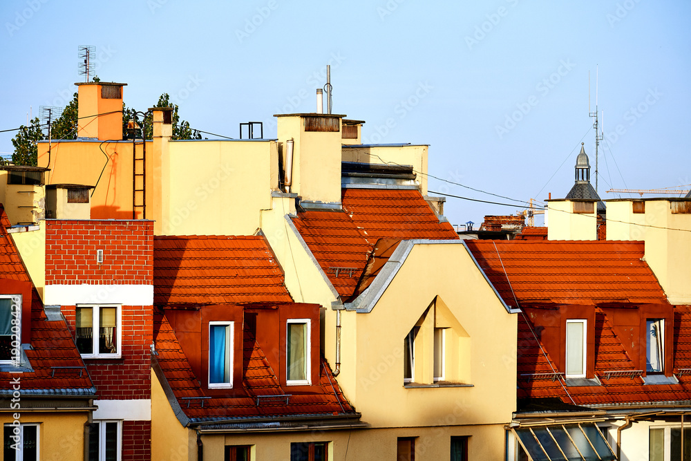 Beautiful houses in Wroclaw with red roofs in the morning sun light