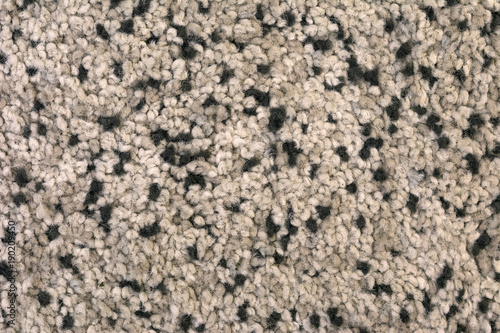 The texture of the carpet with a pile of brown