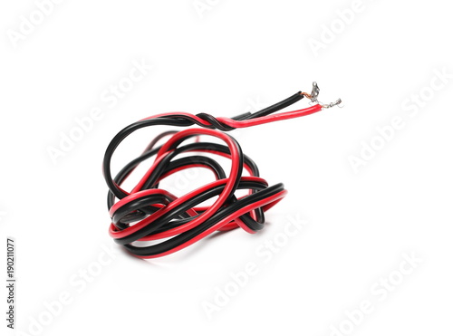 Black and red damaged, cut insulated cable, wire isolated on white background