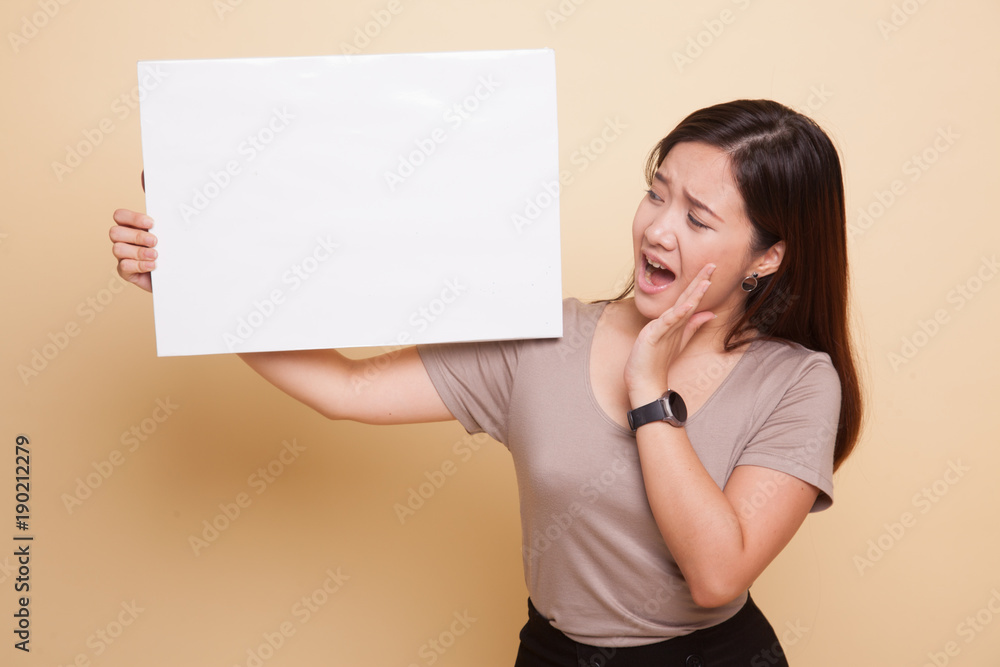 Young Asian woman surprise with white blank sign. Young Asian woman surprise with white blank sign.