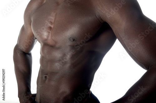 detail of the muscular torso of an African man © curto