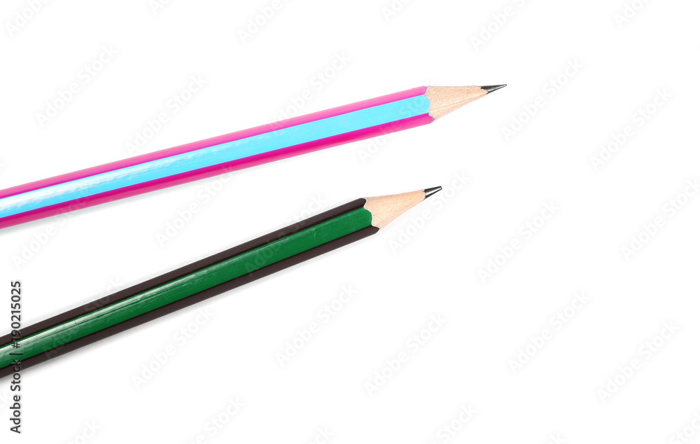 Sharp colorful wooden graphite pencils isolated on white background, top view Sharp colorful wooden graphite pencils isolated on white background, top view
