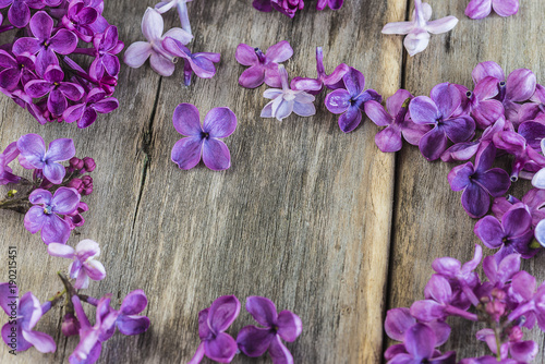purple lilac flowers on rustic wooden background