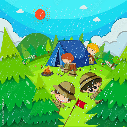 Children camping in park on rainy day