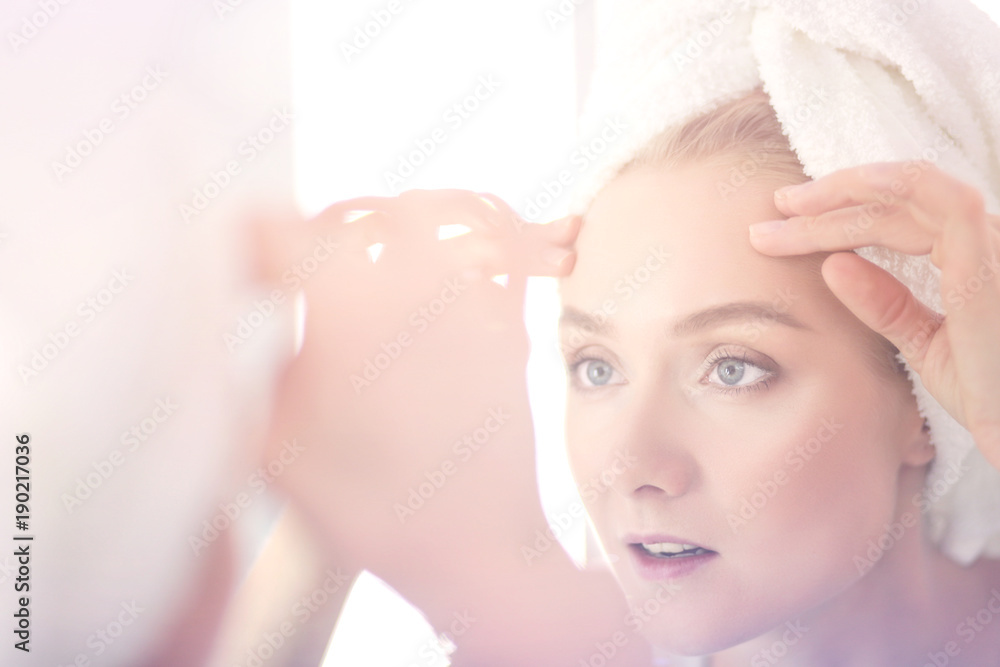 face of young beautiful healthy woman and reflection in the mirror face of young beautiful healthy woman and reflection in the mirror