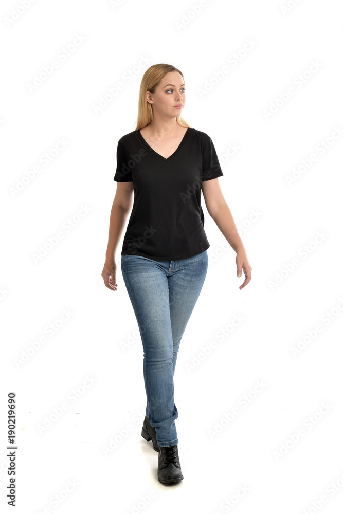 full length portrait of blonde girl wearing black shirt and jeans, standing pose isolated on a white background. full length portrait of blonde girl wearing black shirt and jeans, standing pose isolated on a white background.