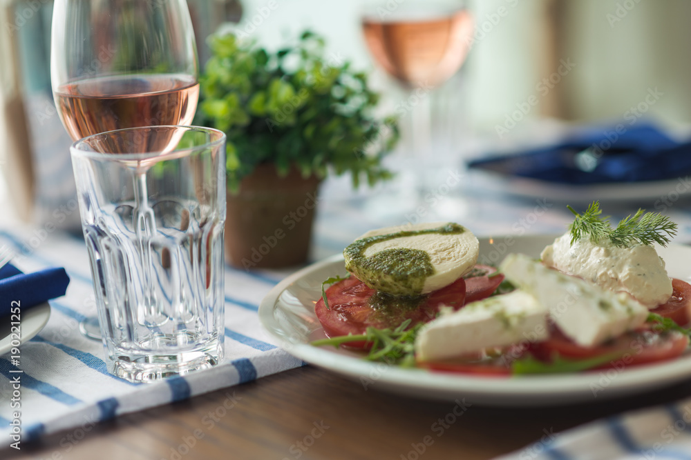 Restaurant table set with glasses, napkins and cutlery Restaurant table set with glasses, napkins and cutlery