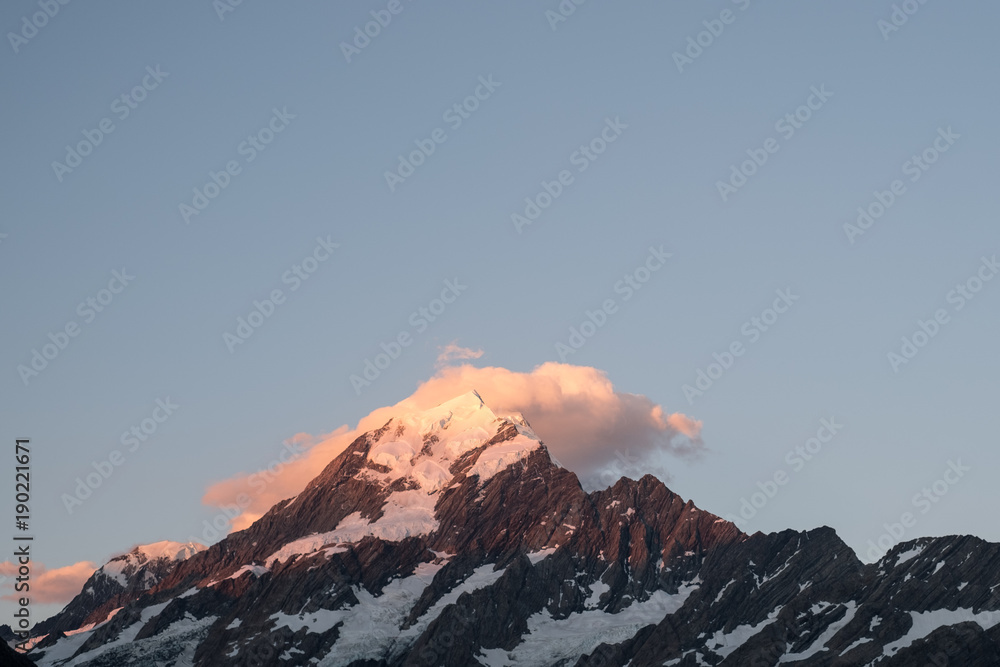 Close up shot, Beautiful mt cook submit before the sunset with yellow color and blue sky, Hook Valley Track, South Island, New Zealand