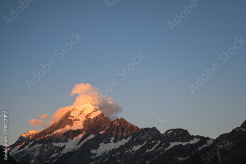 Close up shot  Beautiful mt cook submit before the sunset with yellow color and blue sky  Hook Valley Track  South Island  New Zealand