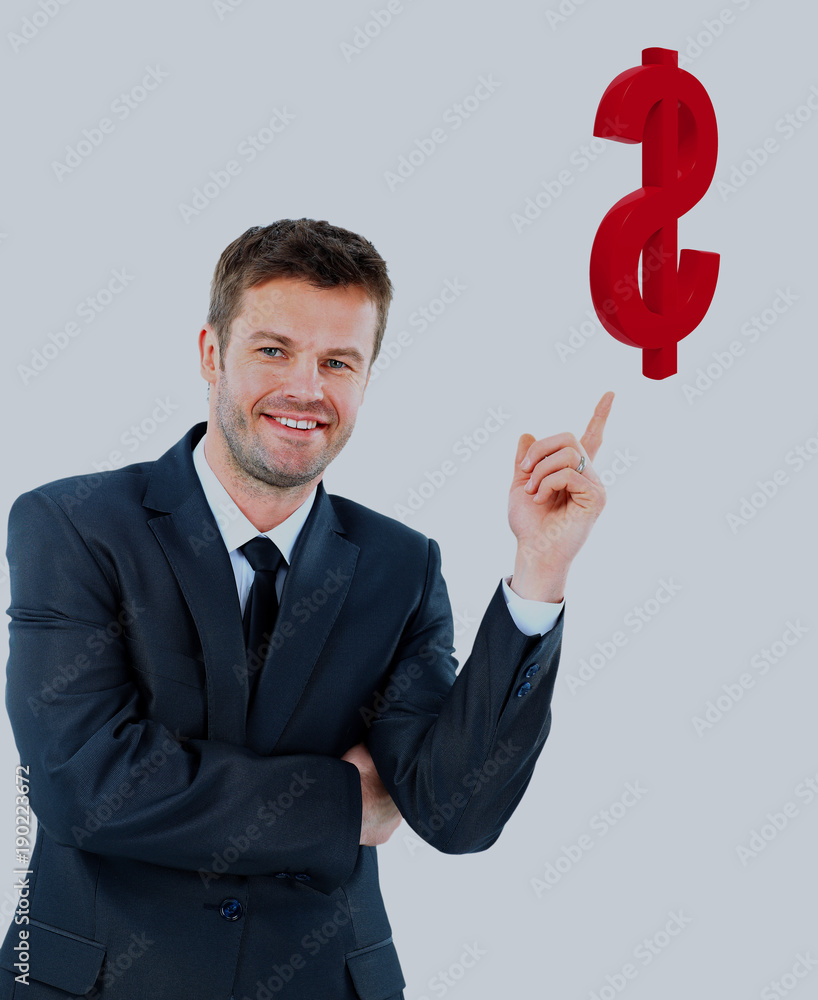 young businessman smiling and points at the the dollar symbol. young businessman smiling and points at the the dollar symbol.