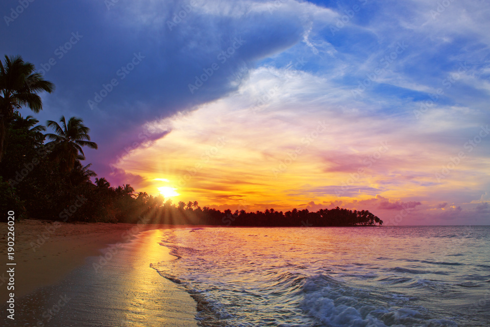 Colorful sunset on tropical beach.