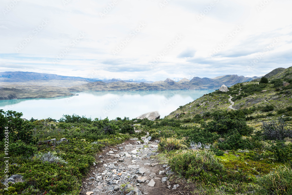 Mountain path hiker at Torres del Paine, Patagonia, Chile