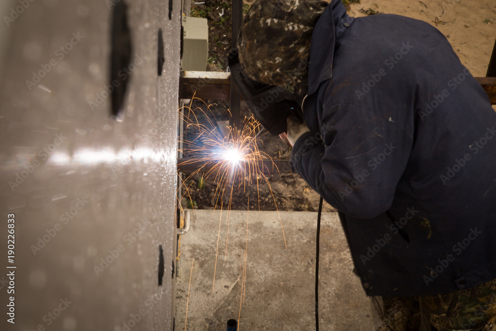 Sparks from welding at the construction site Sparks from welding at the construction site