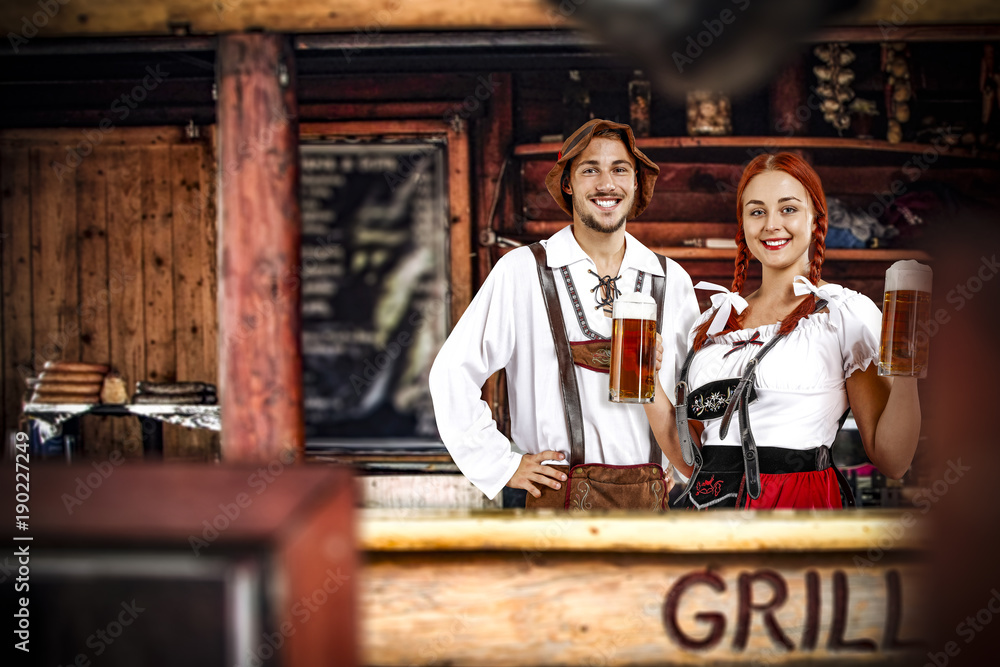 Young bavarian people and their own small business. Grill bar interior. 