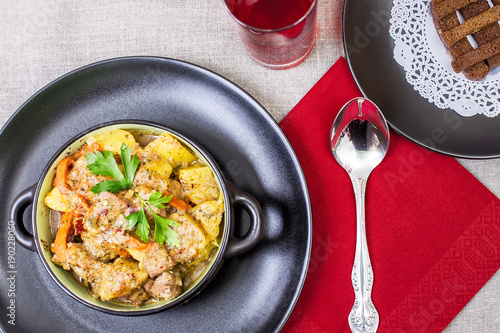 Pork stew served with cooked potatoes