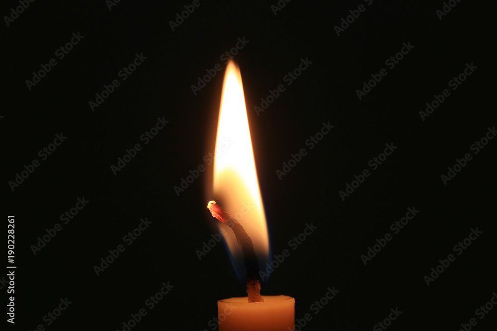 Candle flame burning on black background. Candle flame burning on black background.