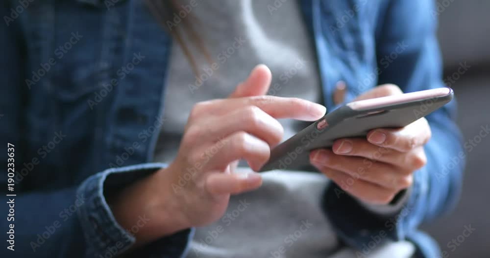 Woman use of mobile phone at home Woman use of mobile phone at home