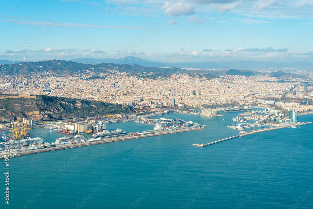 Aerial view of the city of Barcelona.  View to Port Vell In the aircraft above the city, shortly before landing