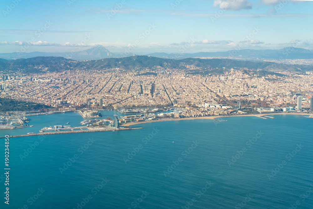 Fototapeta premium Aerial view of the city of Barcelona. In the aircraft above the city, shortly before landing