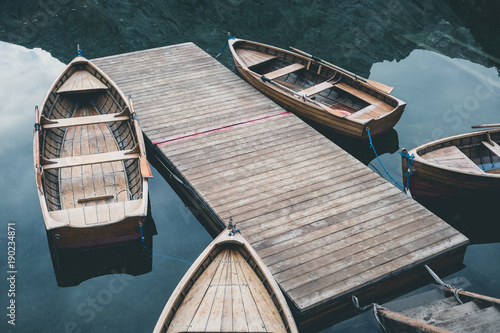 Wooden boats at the Alpine mountain lake. Braies lake, Dolomites, Italy. © Nickolay Khoroshkov
