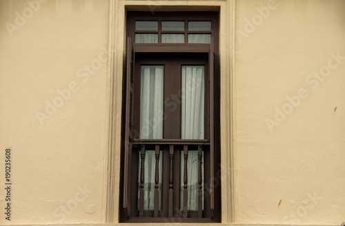 A single windows in the colonial style of Singapore.